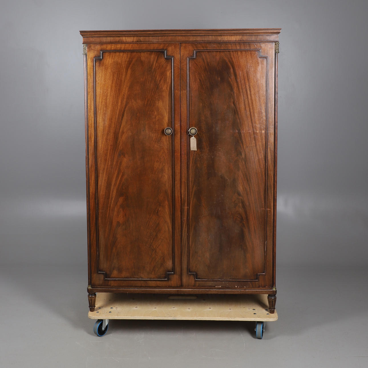 A MAHOGANY TWO DOOR WARDROBE.
