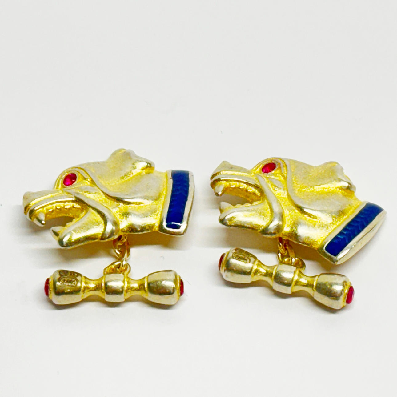.84 SILVER GILT, ENAMELLED &RUBY SET CUFFLINKS.