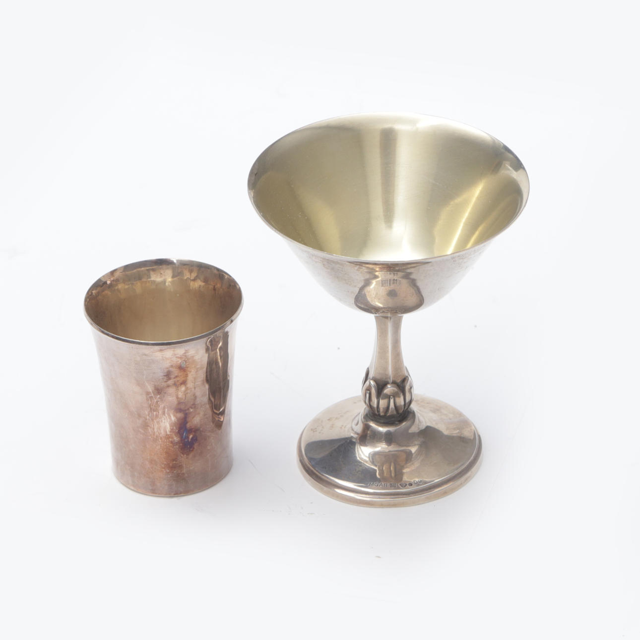 A 2-piece beaker, silver.