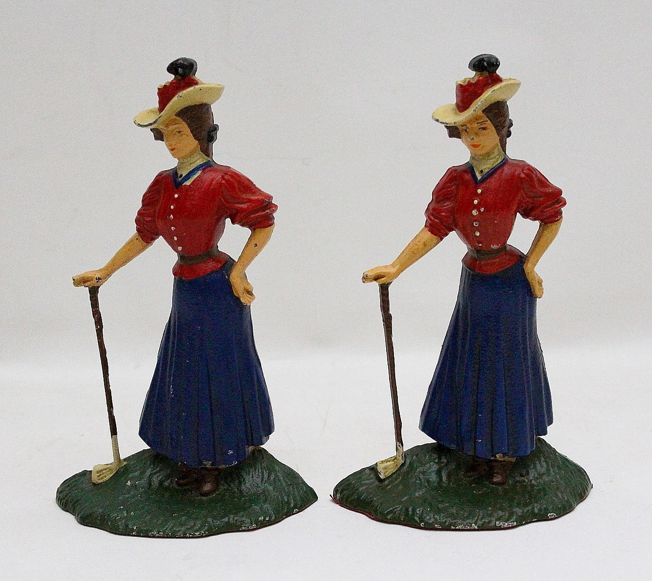 BOKSTÖD, 2 st, bemålad gjutjärn.