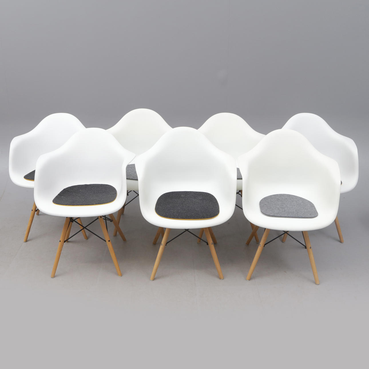 A set of 7 armchairs, Eames style.