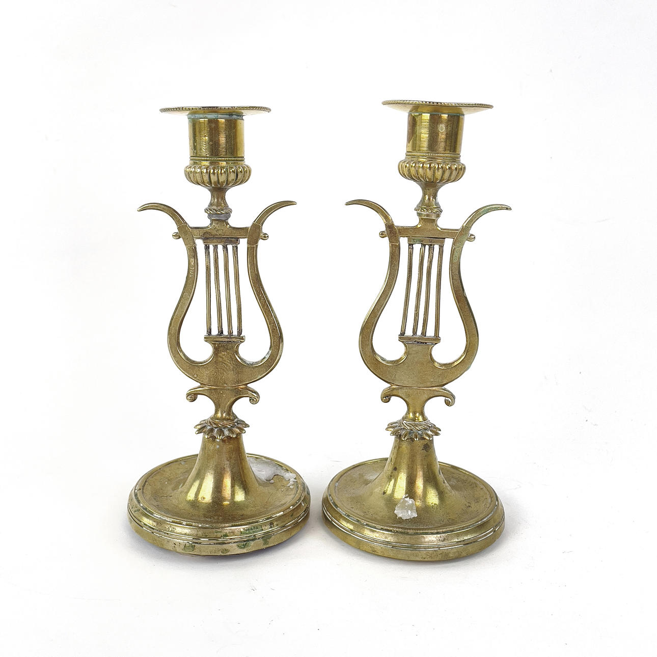 TWO CANDLESTICKS, brass, lyre model, 1800/20th century.