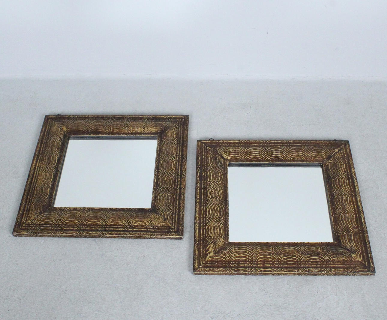 A pair of mirrors/wall mirrors.