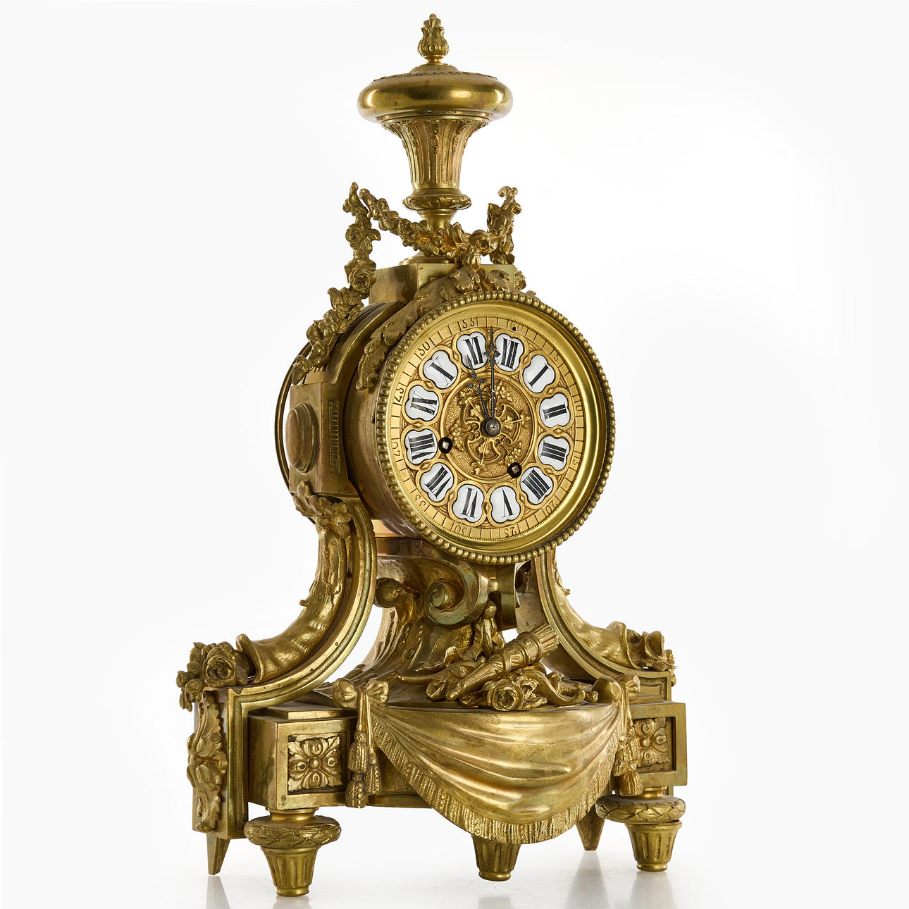 A brass table pendant, end of the 19th century. Roman numerals on enamel.