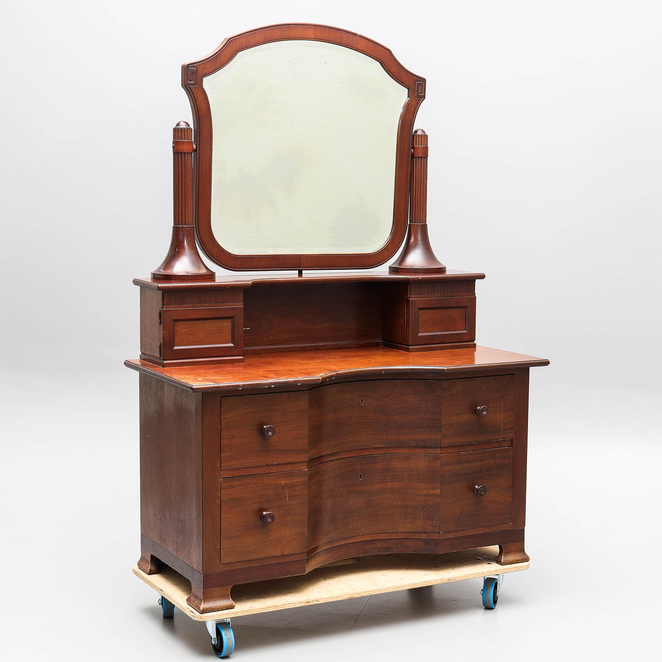 A 20th century colonial style mirror cabinet.