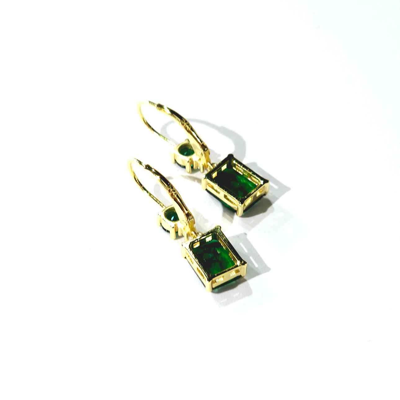 Silver frame earrings with zircons.