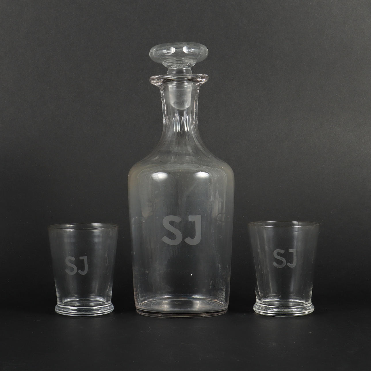 DECANTER AND 2 GLASSES marked SJ.