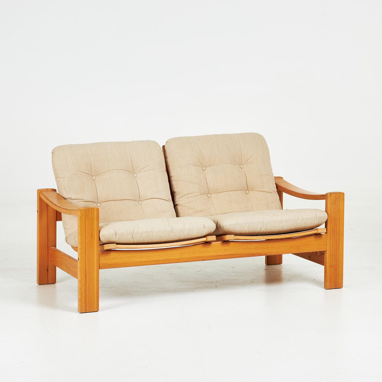A sofa, pine, with cushions, 1970s.