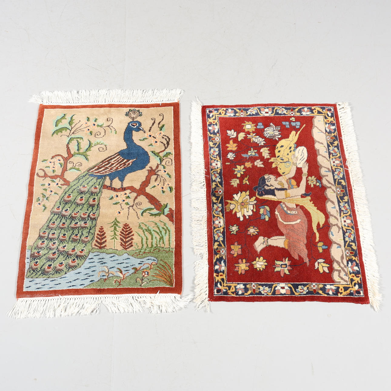 A set of 2 figural rugs.