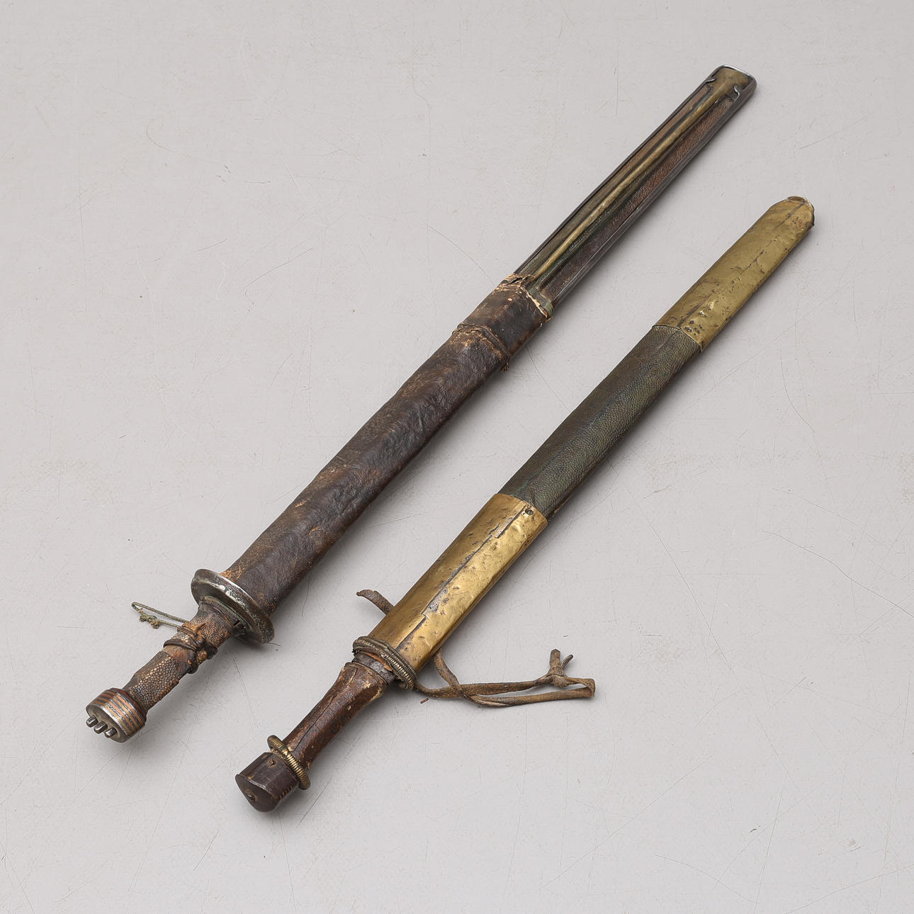 A pair of Bhutan/Nepal/Tibet PATAG swords, steel, wood and brass ...