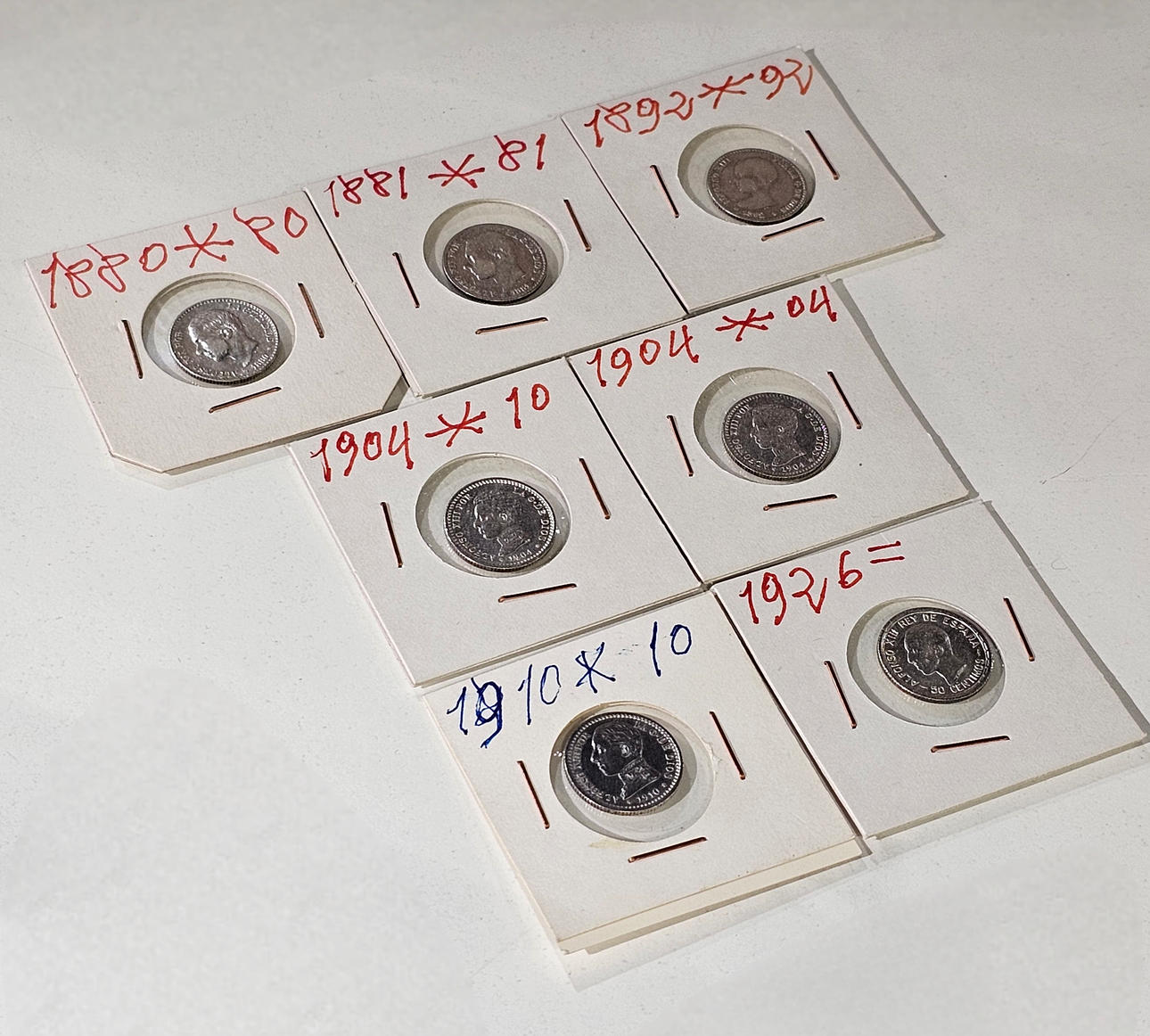 Samling av sju 50 cent spanska silvermynt.