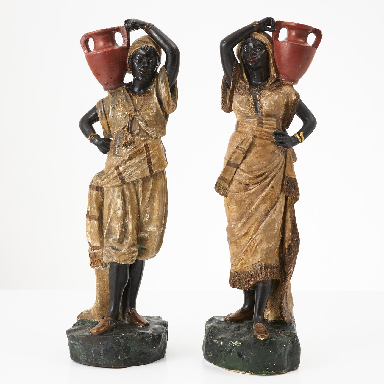TWO SCULPTURES, circa 1900, painted plaster, water carrier.