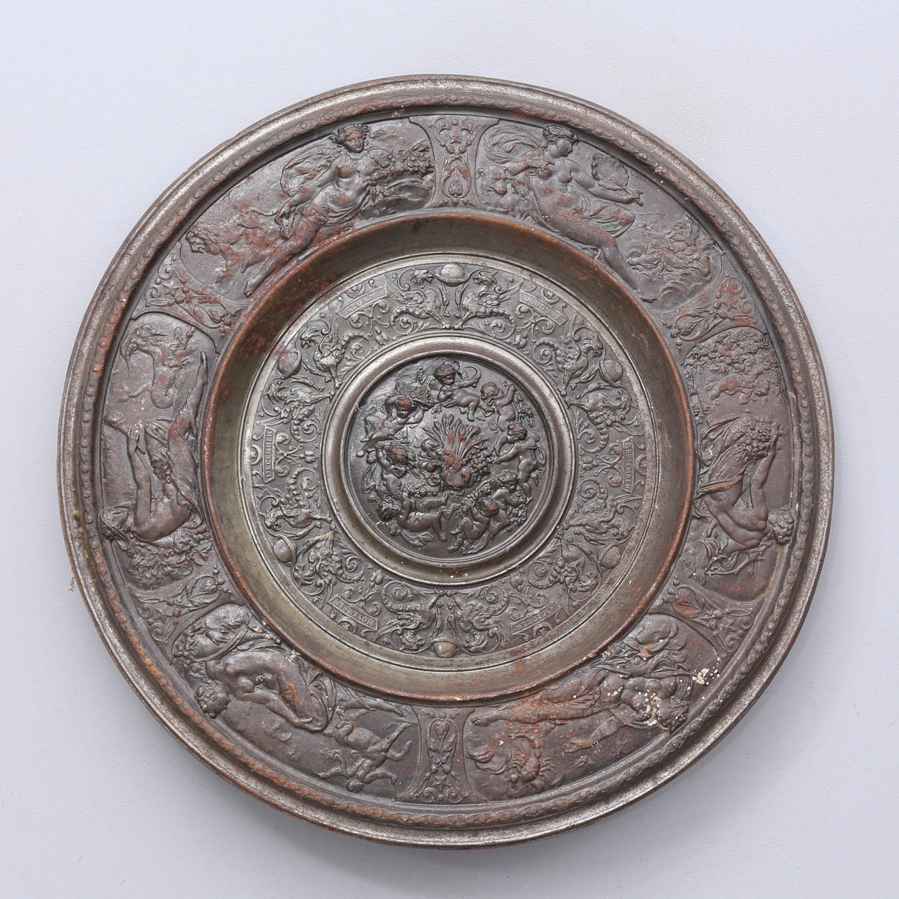 Wall shield, cast iron, with calendar.