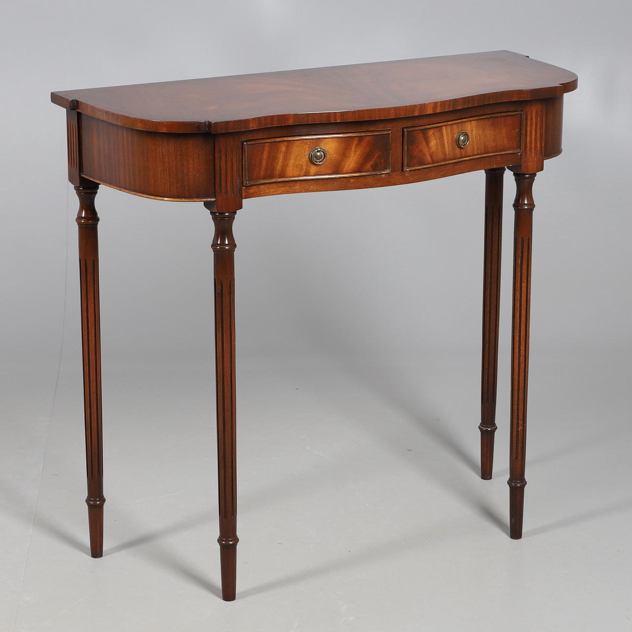 A MAHOGANY FINISH HALL TABLE BY BEVAN FUNNELL.