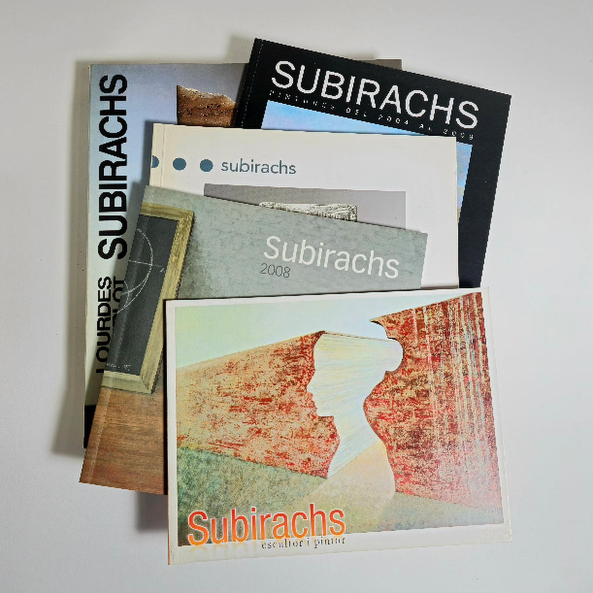 SUBIRACHS WORK BOOK AND 4 EXHIBITION CATALOGS.