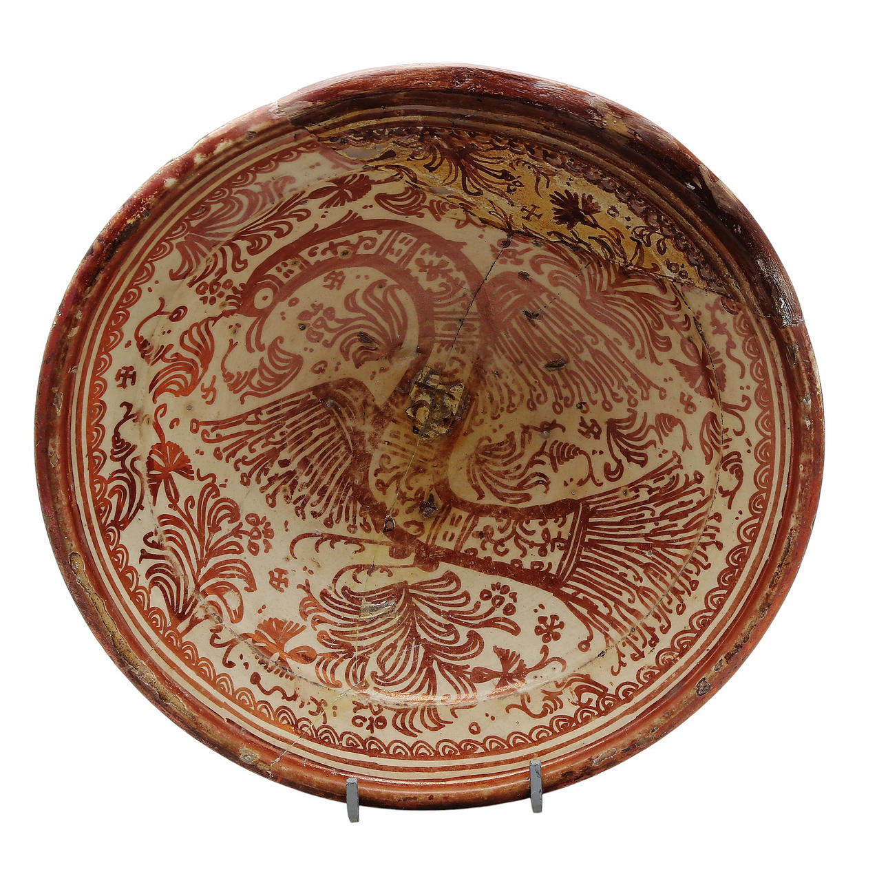 Dish in earthenware with a metallic reflection “del perdalot” by Manises, from the 18th century.