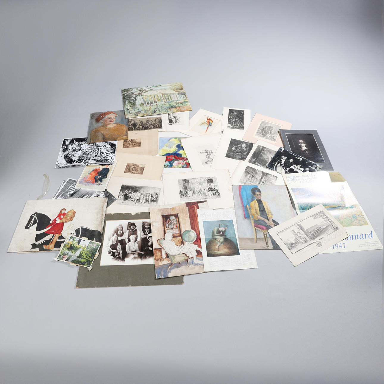 A FOLIO OF ARTWORKS.