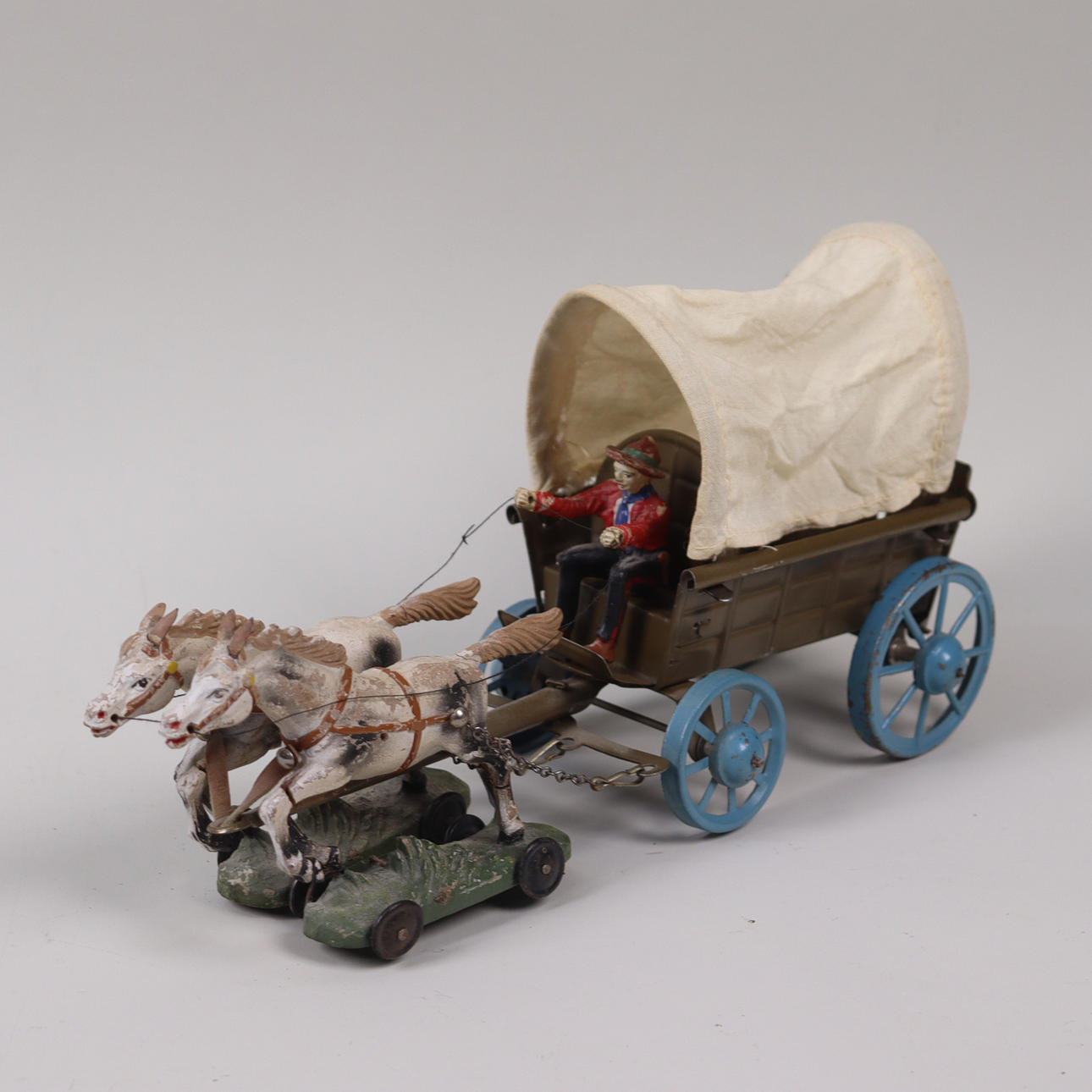 COWBOY TROLLEY, plate/elastoline, mid 20th century.