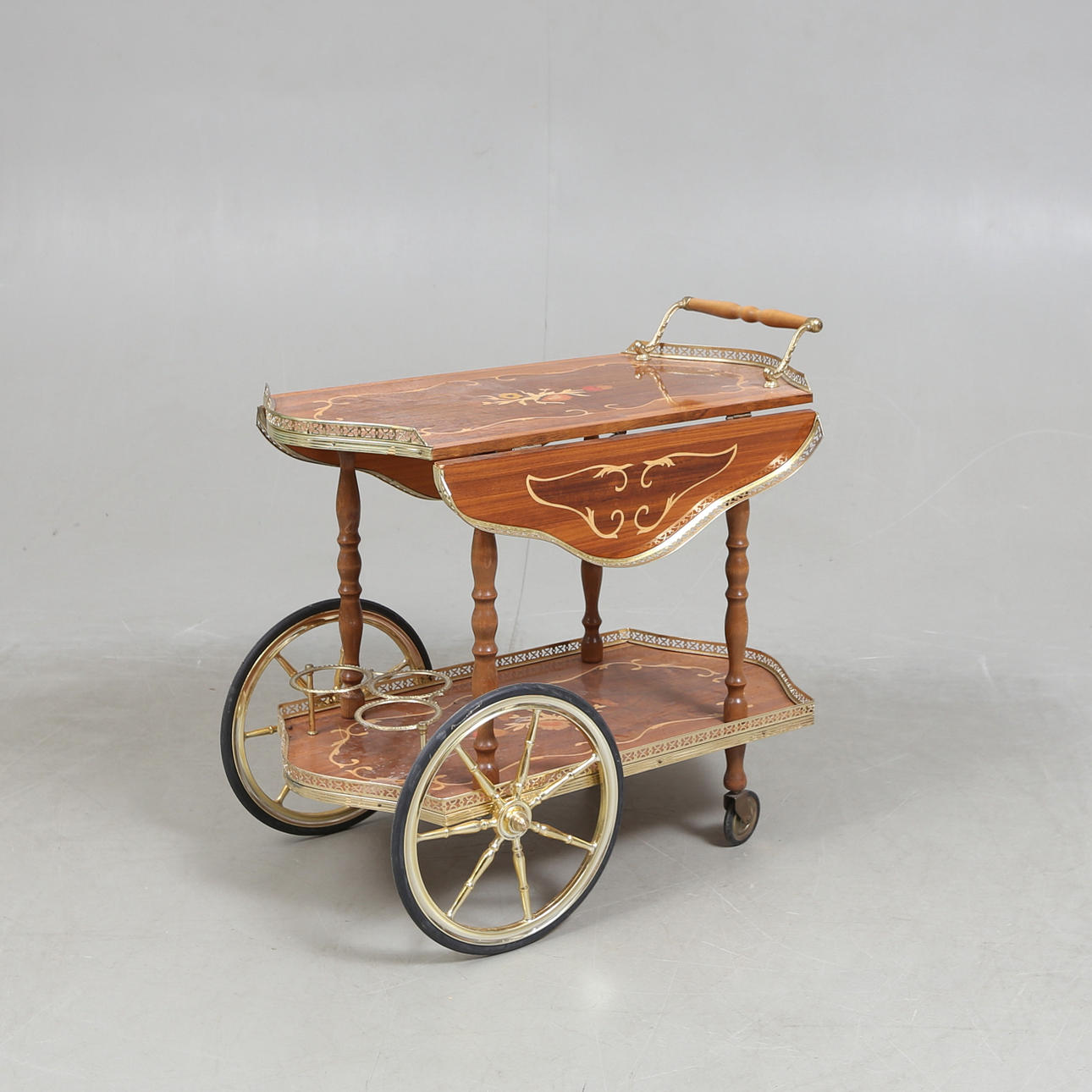 A 20th century Intarsia dining trolley.