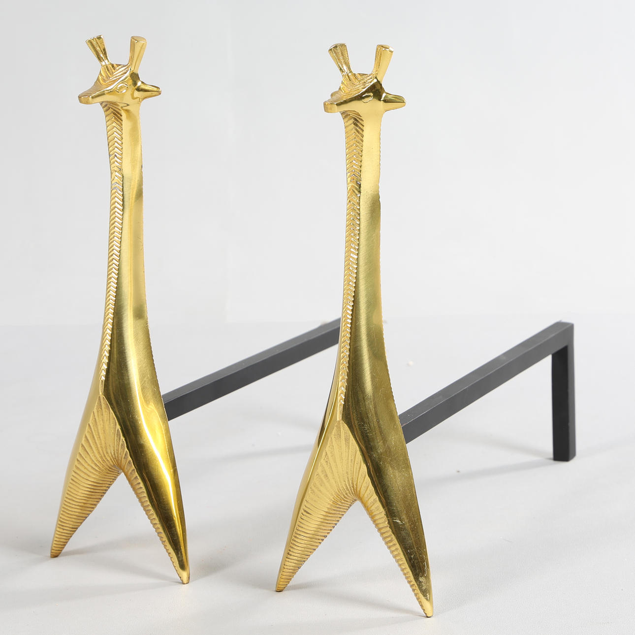 JONATHAN ADLER (B. 1966). BRASS GIRAFFE ANDIRONS (2).