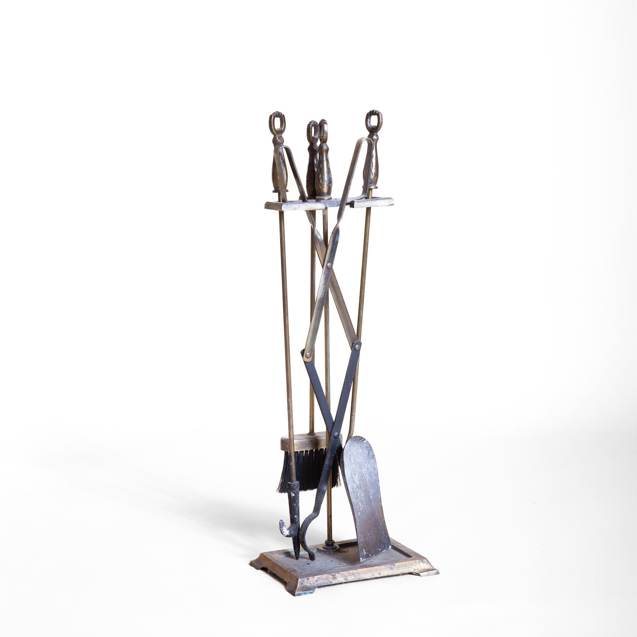 FIRE TOOLS ON A STAND, 5 pieces, brass, 20th century.