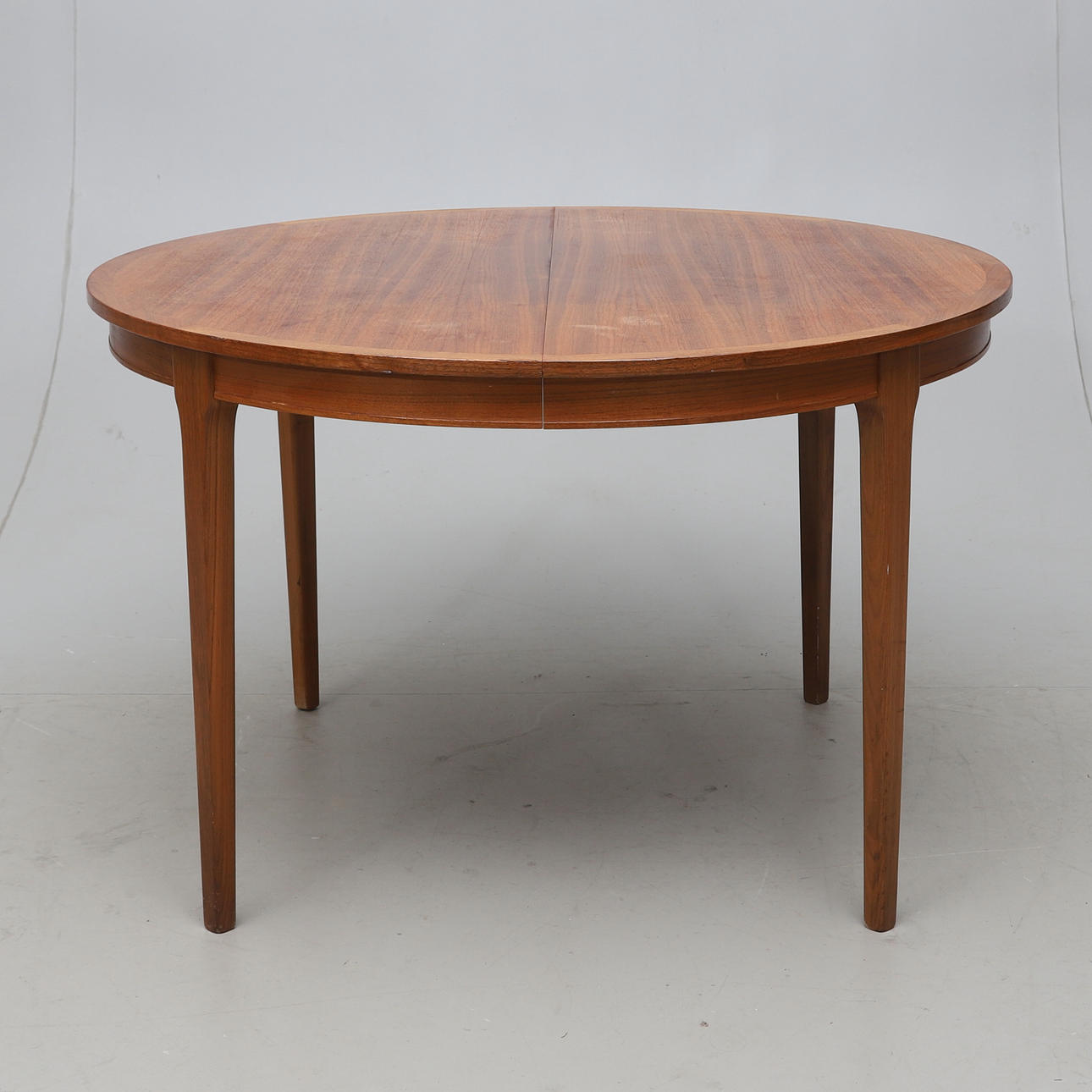 A Swedish modern mahogany/walnut dining table, 1940s.