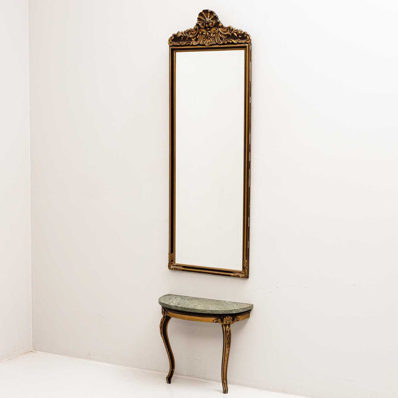 A late 20th century rococo stone top mirror with console table.