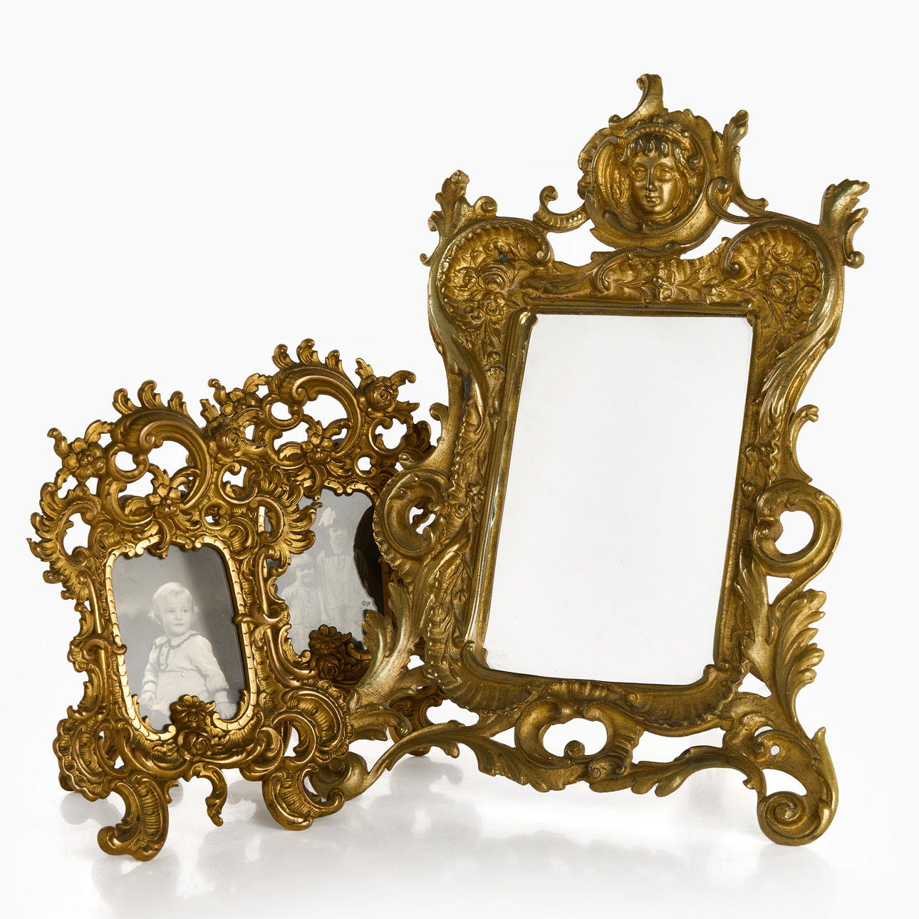 A pair of picture frames, a bronze table mirror, 20th century.