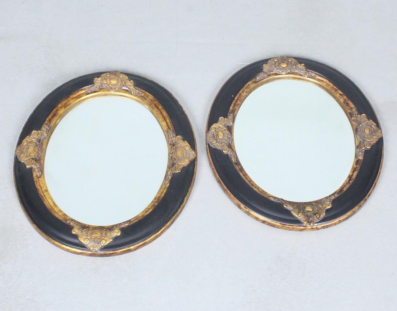 A pair of mirrors/wall mirrors.