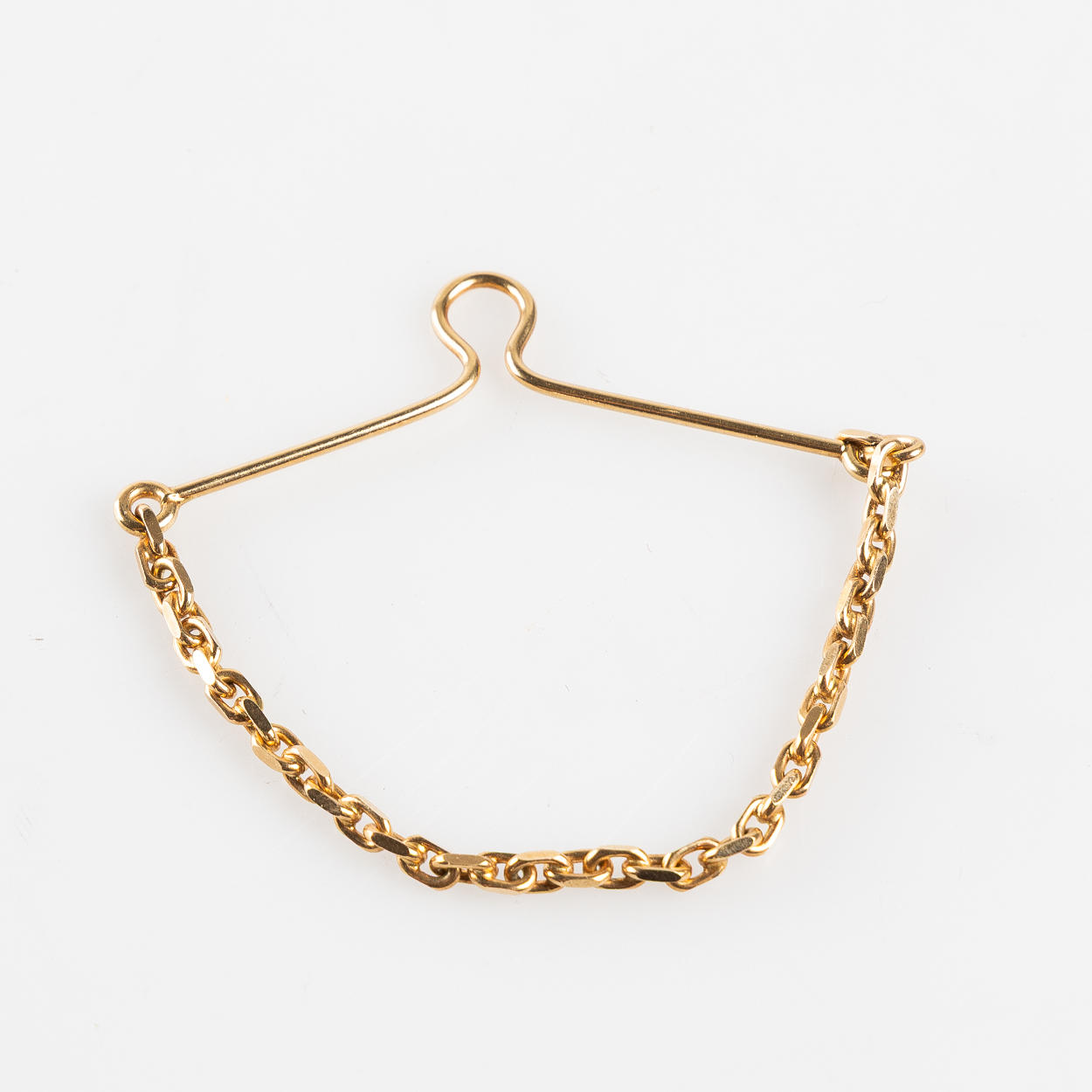 KRAWATTENHALTER. 14-karätiges Gold.