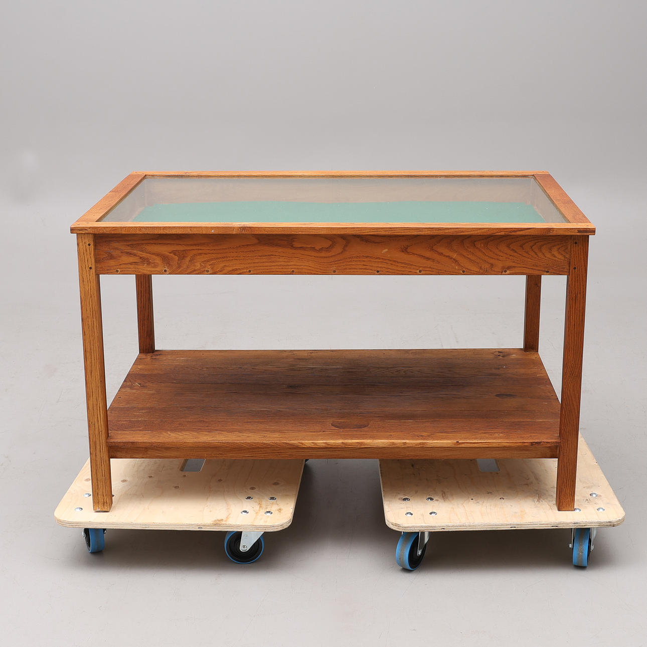 STAND TABLE, oak and glass. Mid 20th century.