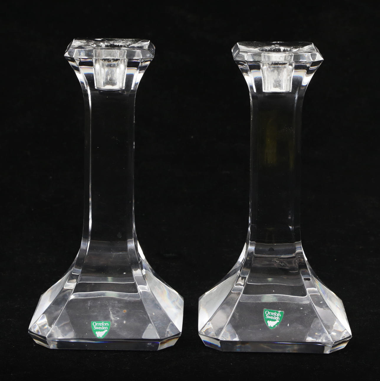 A pair of Orrefors glass candlesticks, unsigned.