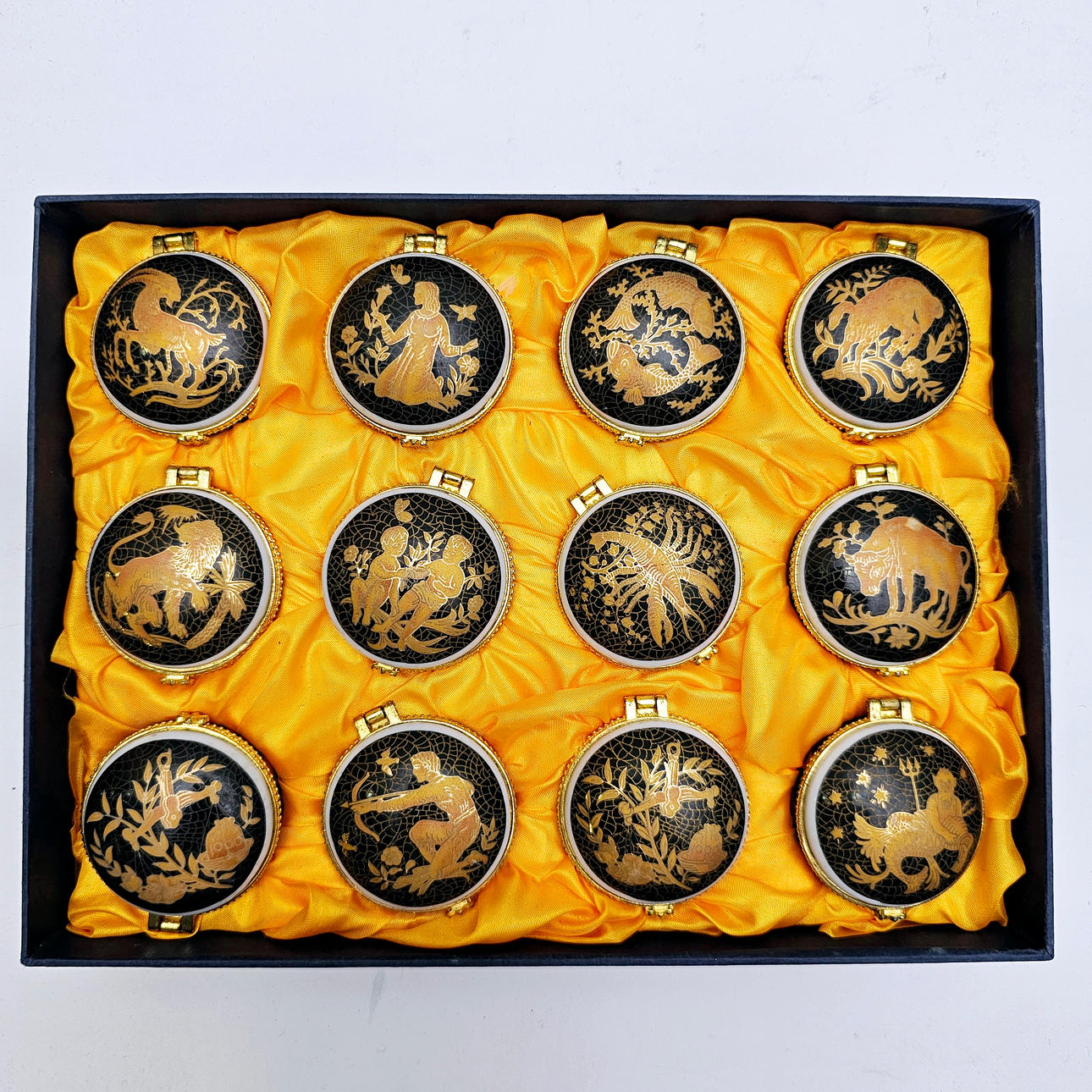 BOX WITH 12 HOROSCOPE FACES.