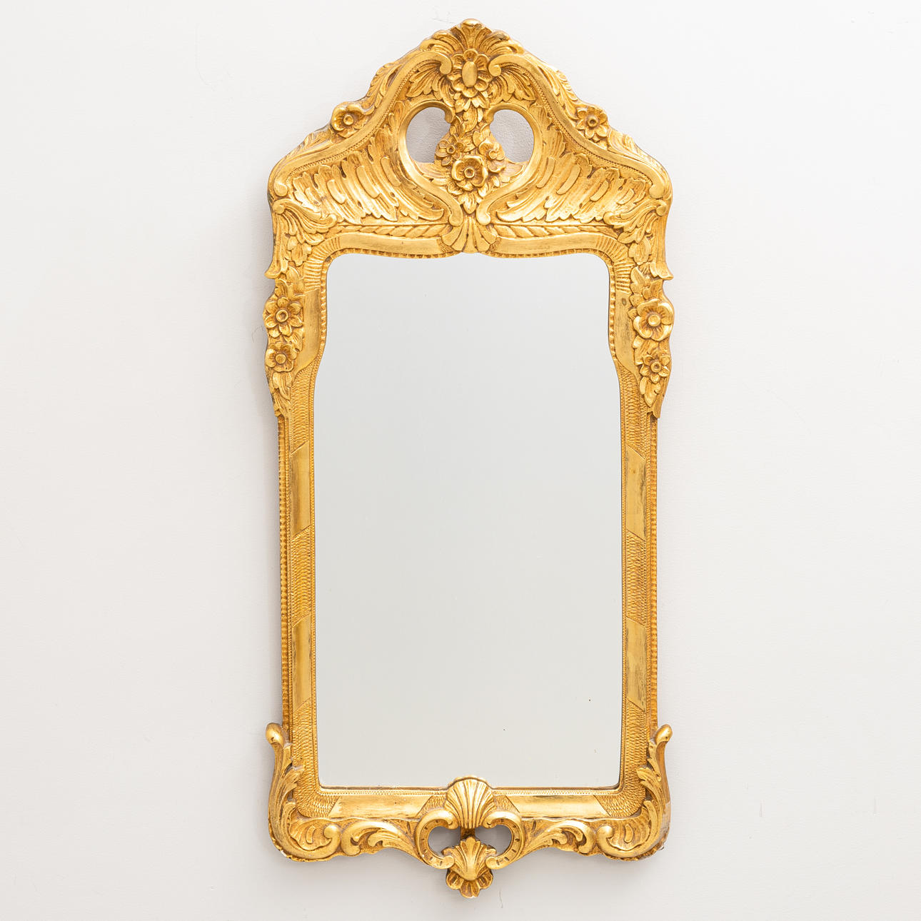 A rococo style mirror from the second half of the 20th century.