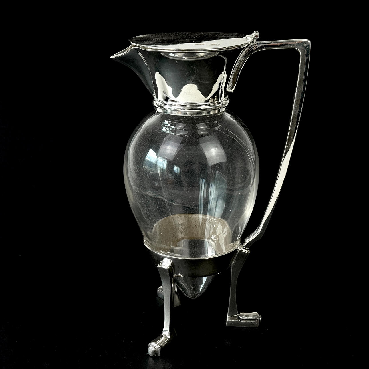 SILVER PLATE MOUNTED CLARET JUG.