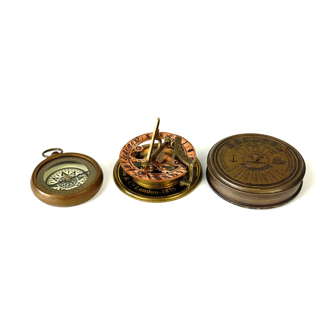 THREE REPRODUCTION COMPASSES AND CALENDARS.