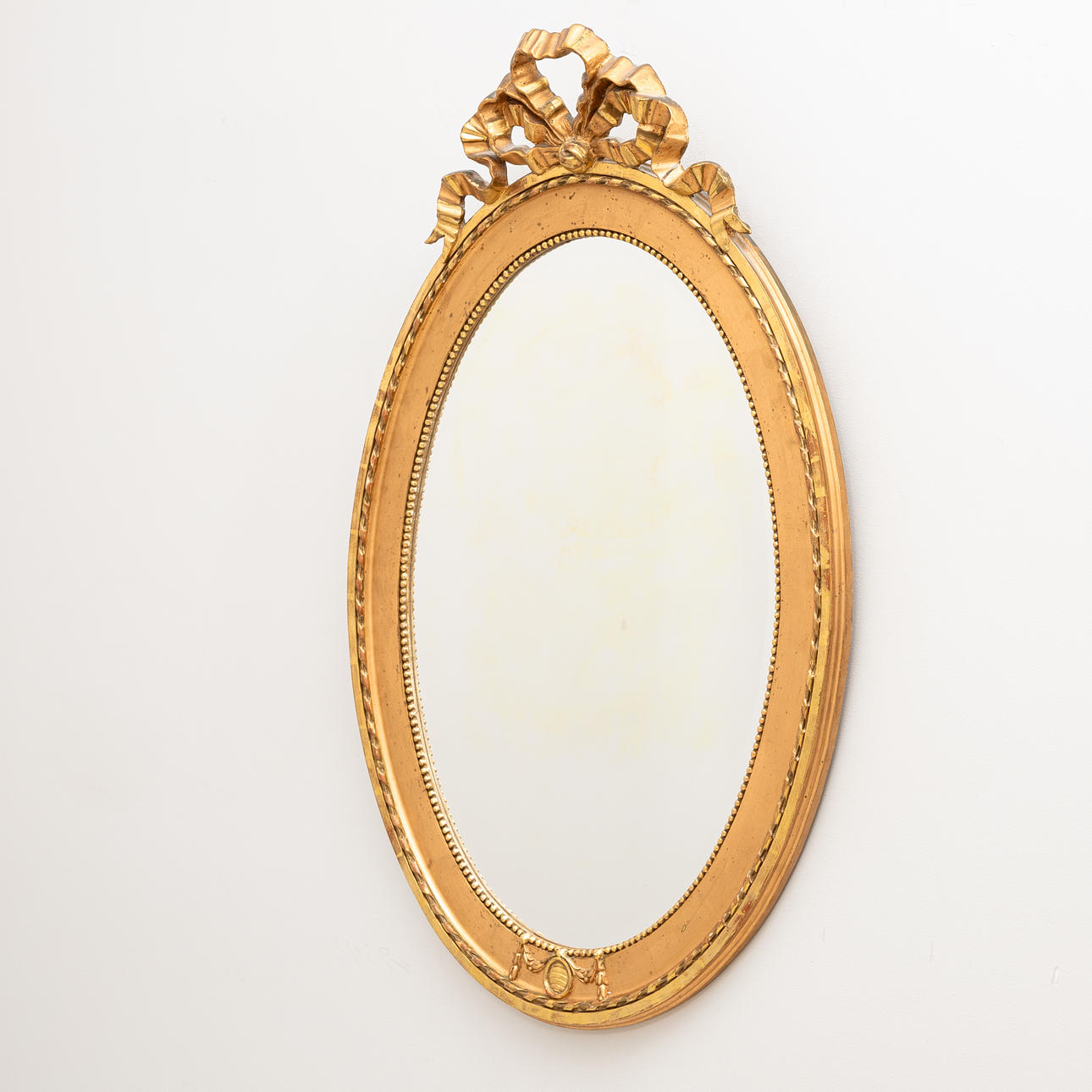 A 20th century Gustavian style gilt mirror.
