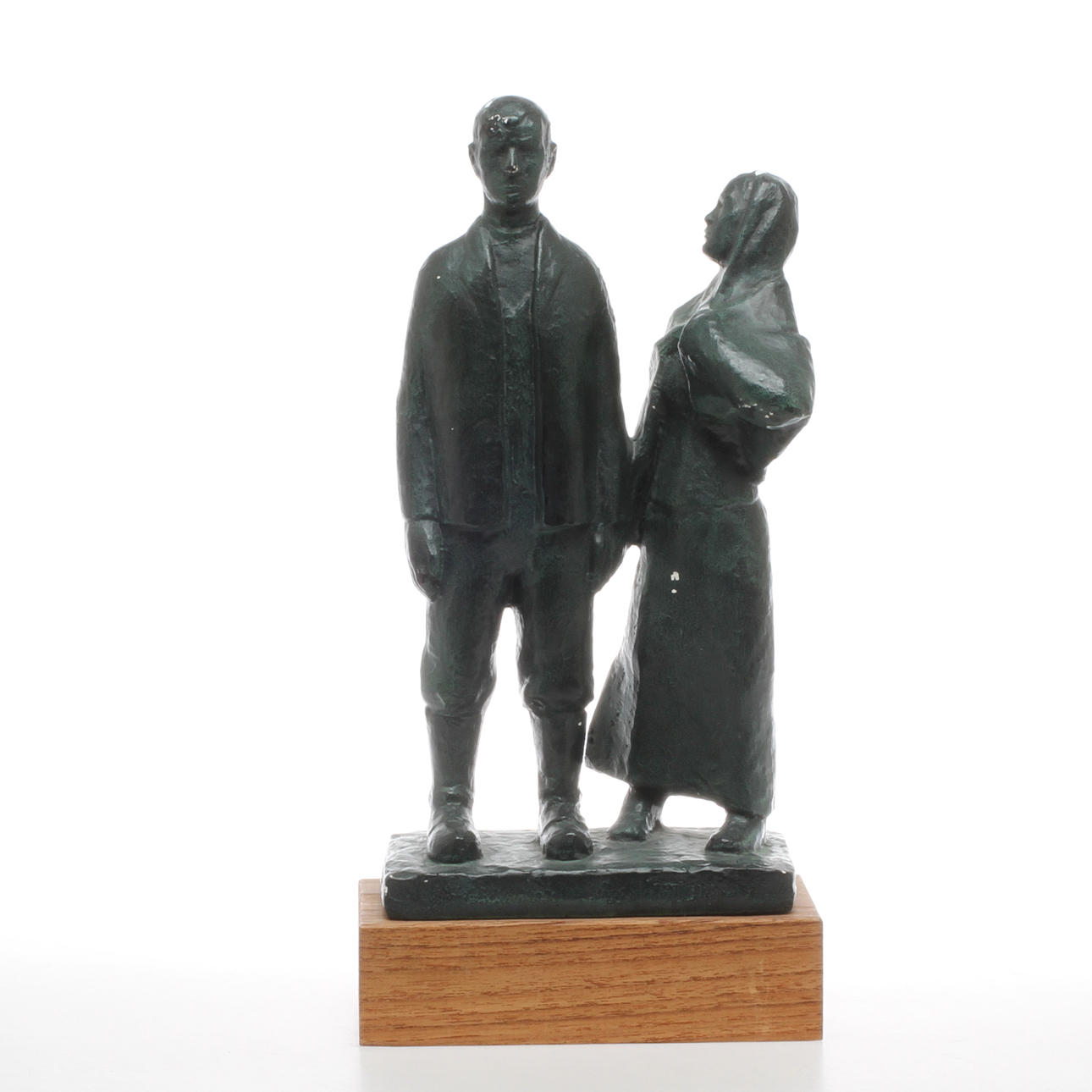 AXEL OLSSON. "Utvandrarna", patinerat gips, signerad.