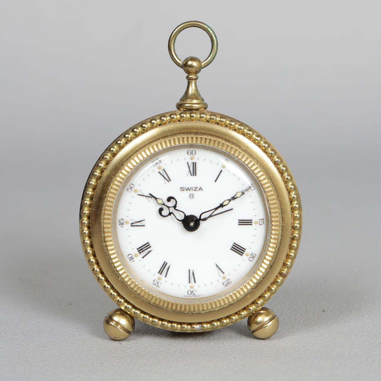A SWIZA 8 DAY TRAVEL CLOCK. Clocks & Watches - Carriage