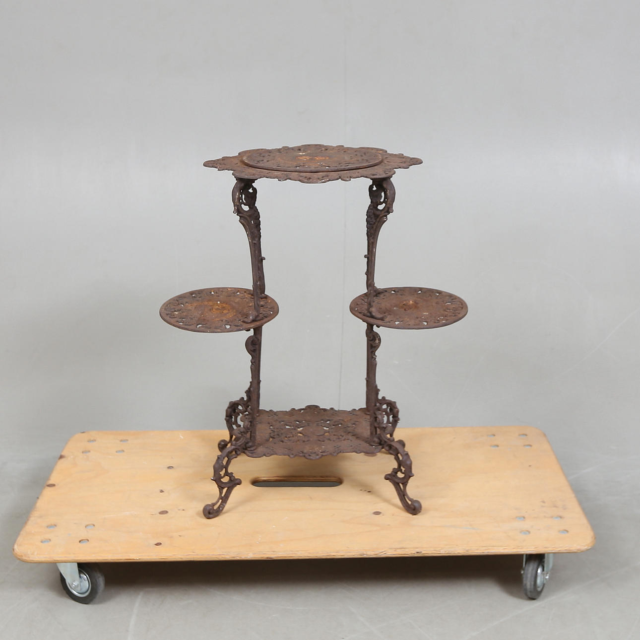 A 20th-century cast iron flower table.