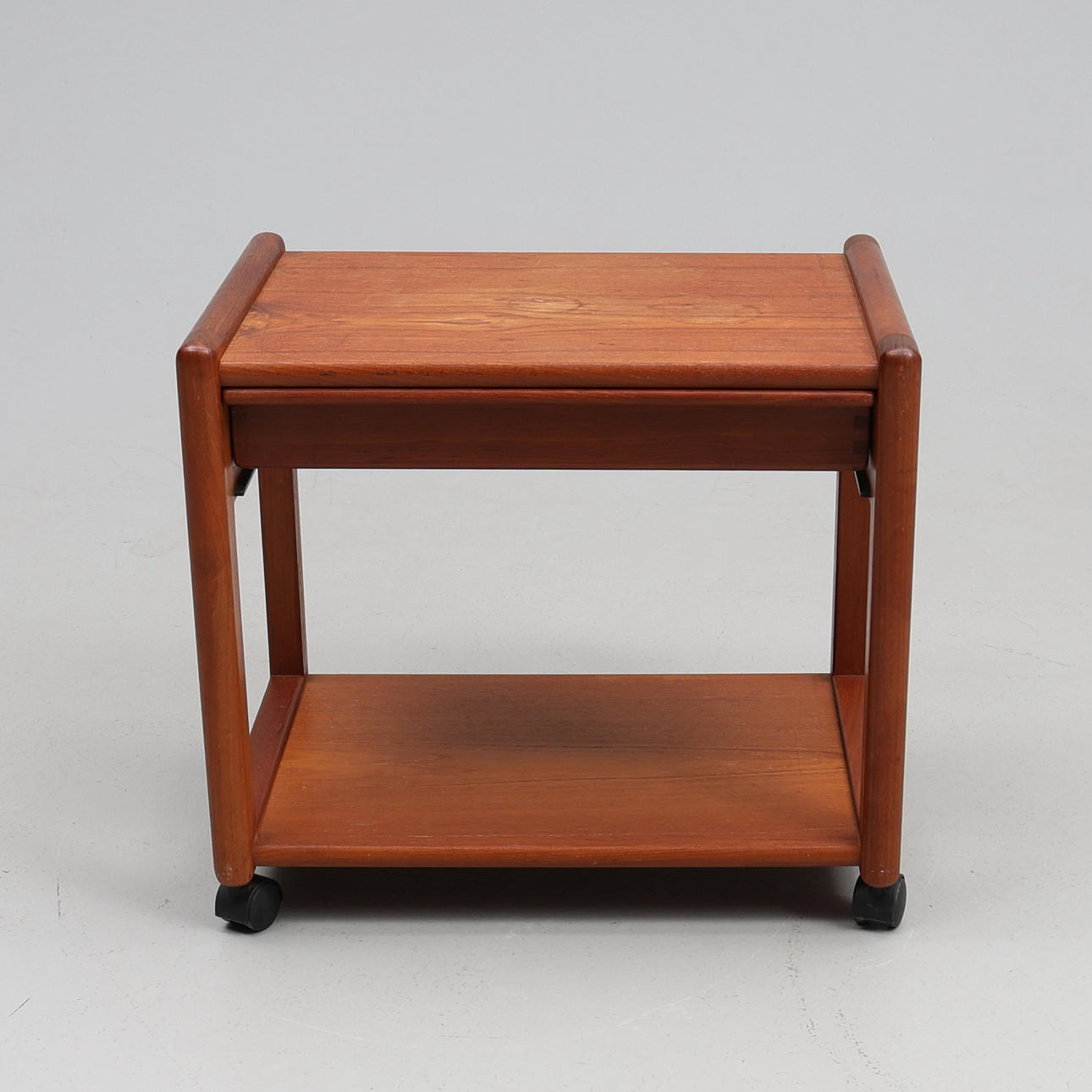 SIDEBOARD. A teak, Aksel Kjaersgaard, wheels, a box.