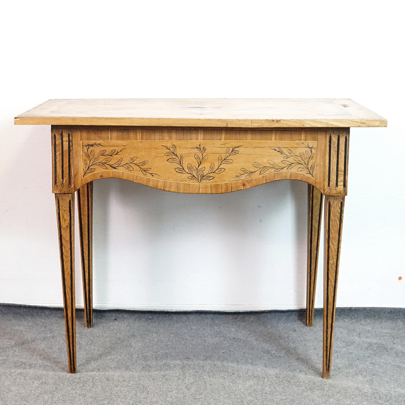 A 19th century intarsia table.