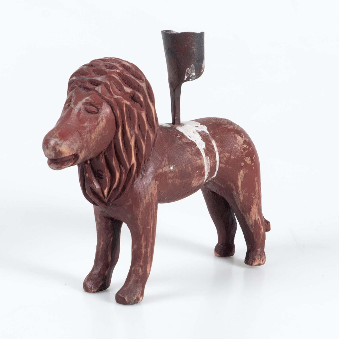 A CANDLESTICK IN THE SHAPE OF A LION, Dalarna, 18th-20th century.