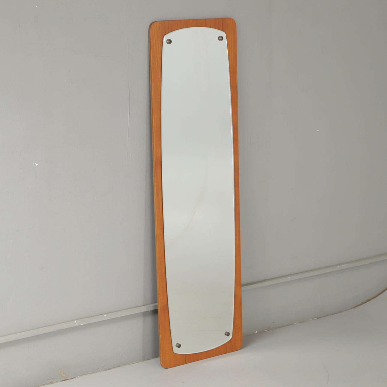 A mid 20th century teak mirror.