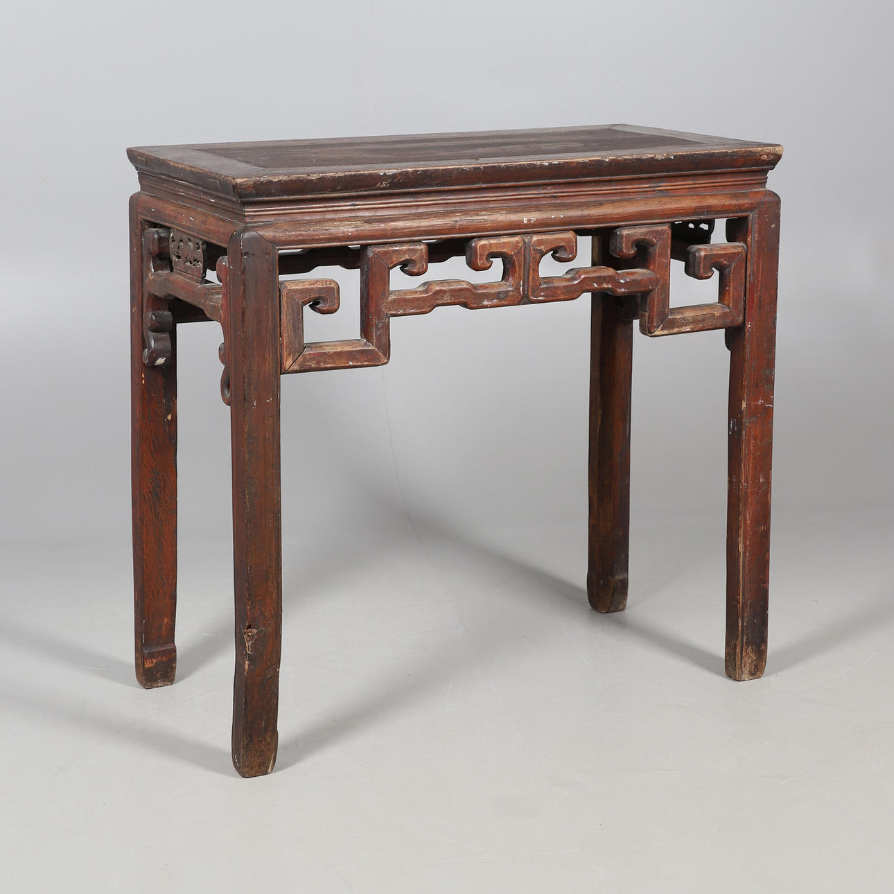 A CARVED CHINESE HARDWOOD ALTAR TABLE.