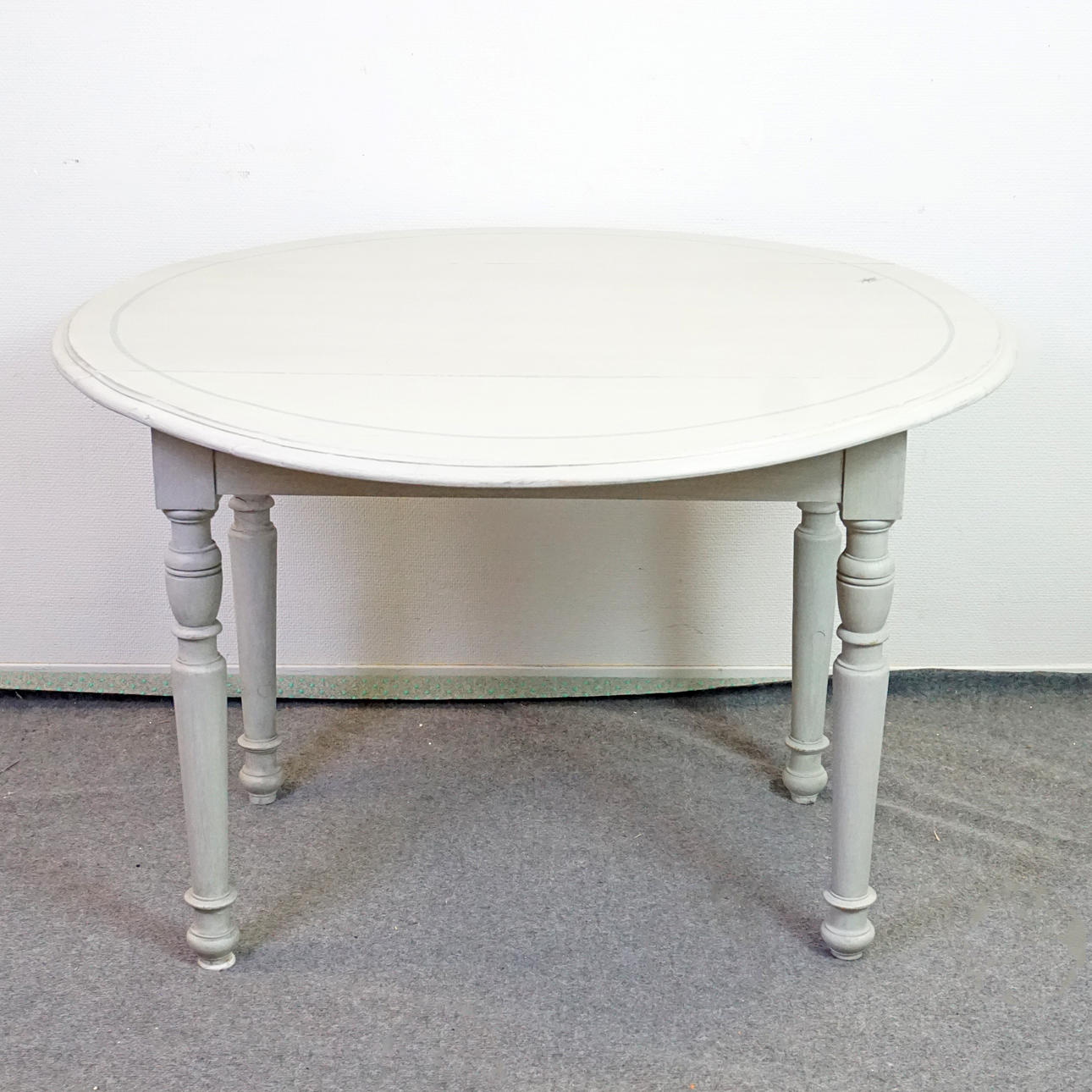 A table with flaps, later painted, 20th century.