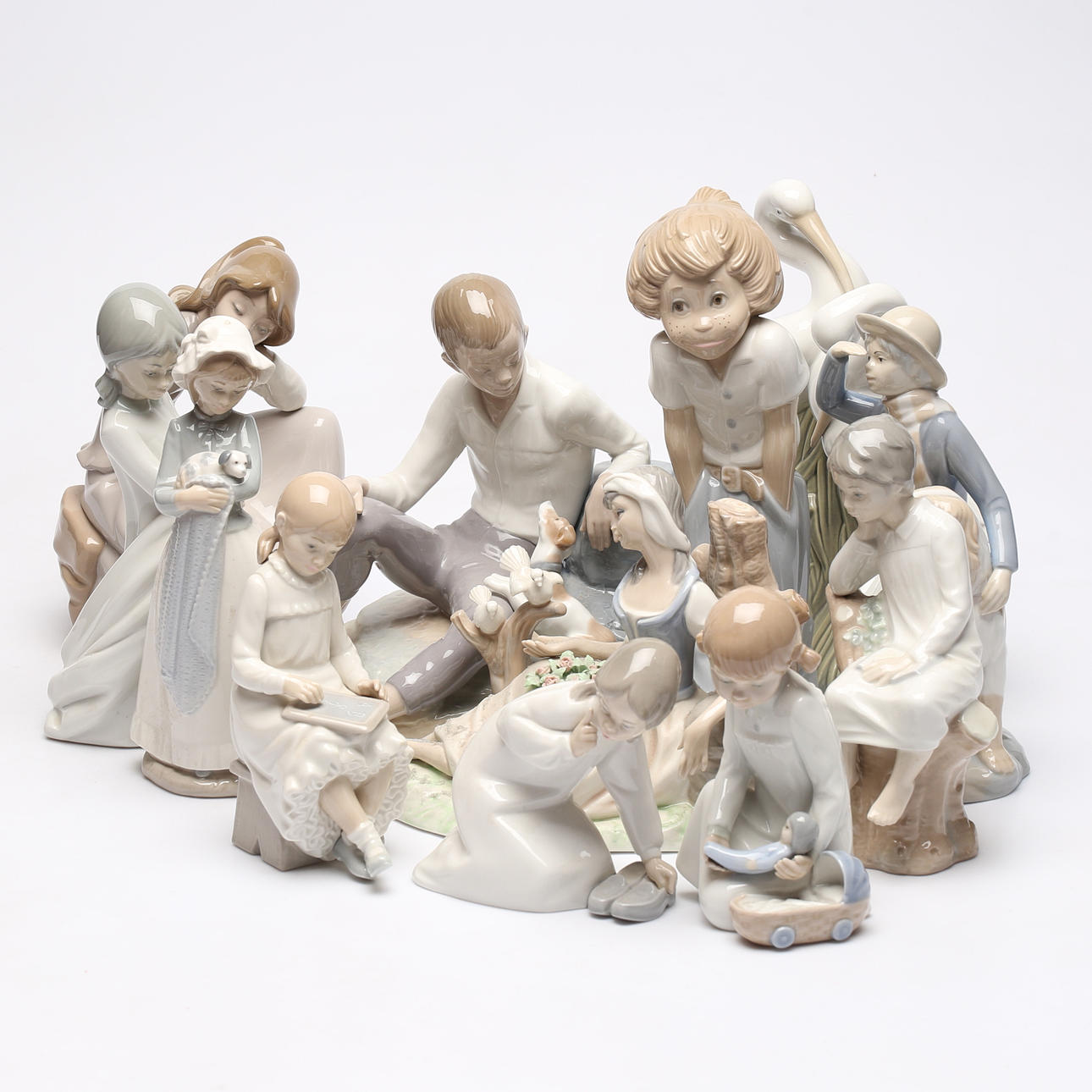 11 porcelain figurines, mostly Spain.