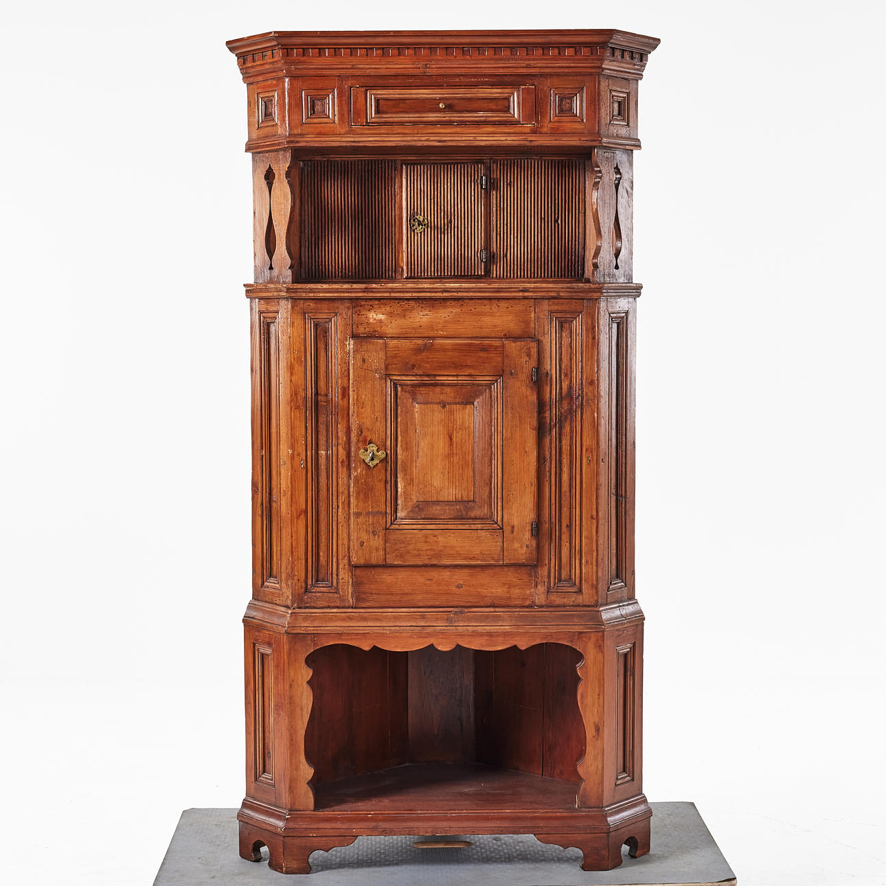 A corner cabinet, 18th century, pine, blacksmith fittings.