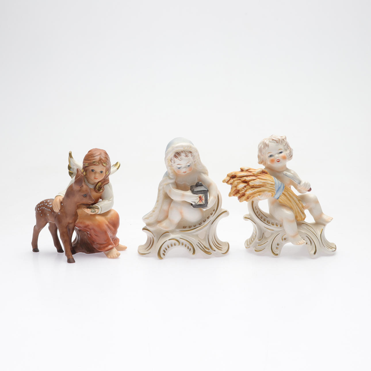 Three ceramic figurines, Goebel, Germany.