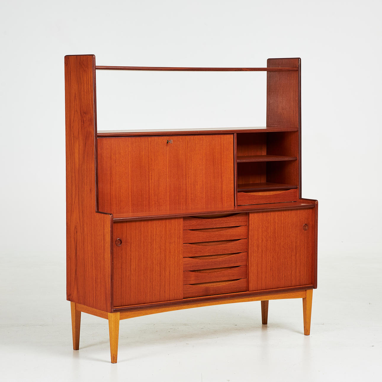 CABINET, teak, Bräntorps, 1950/1960's, top with shelf, drawer and desk, bottom with 6 drawers and sliding doors with rear shelves.